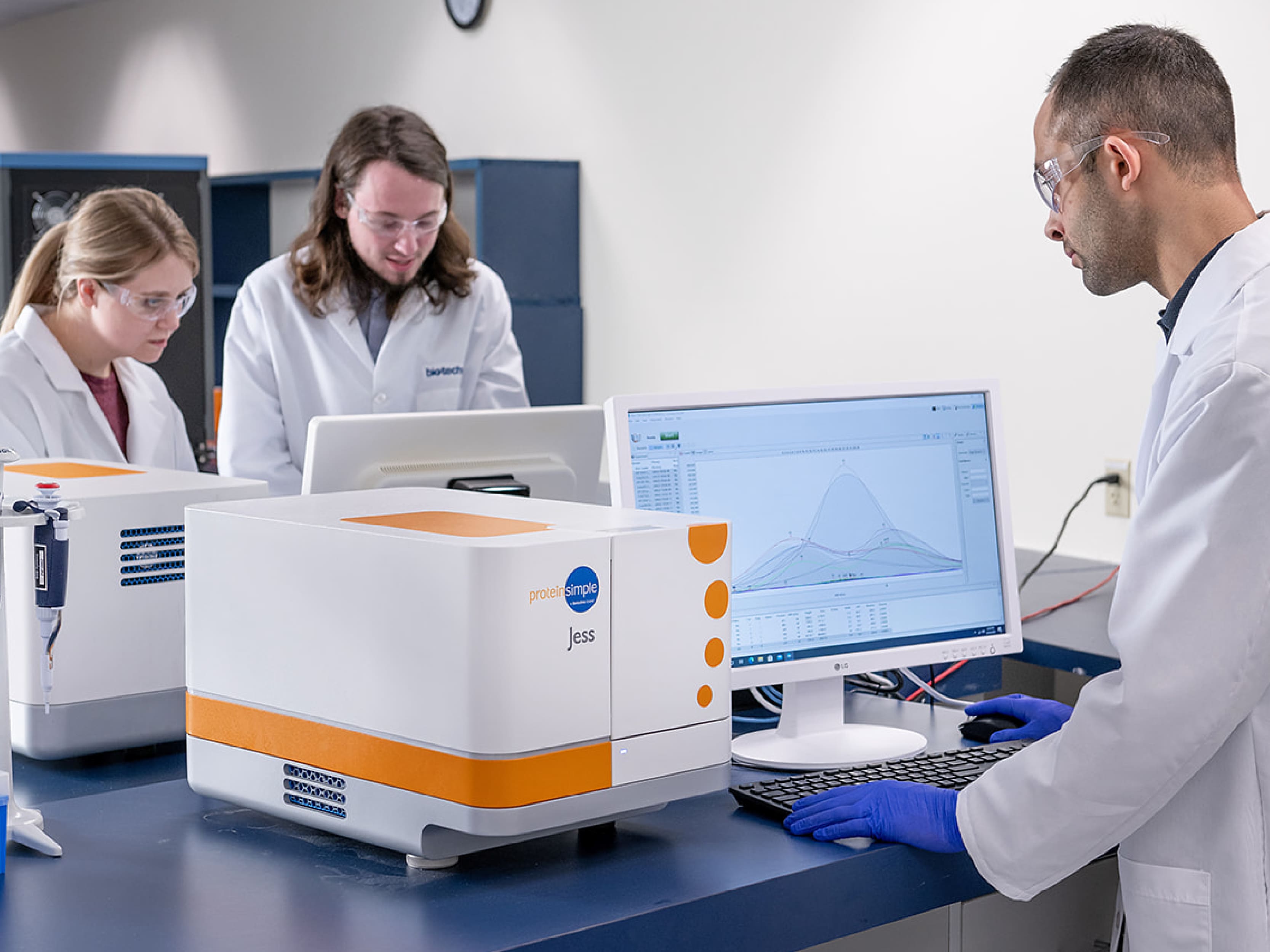 Scientists running Simple Western™ immunoassays